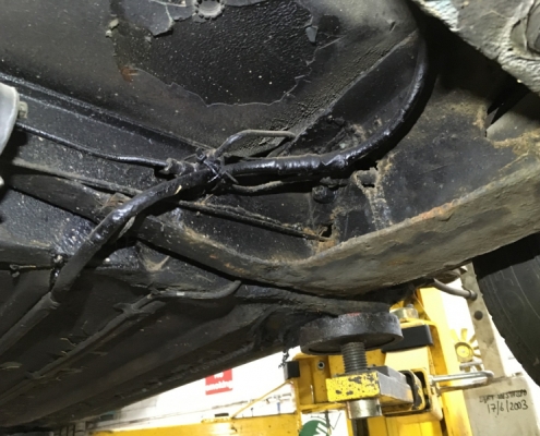 Multiple welds on rear subframe - interesting way to hold battery cable